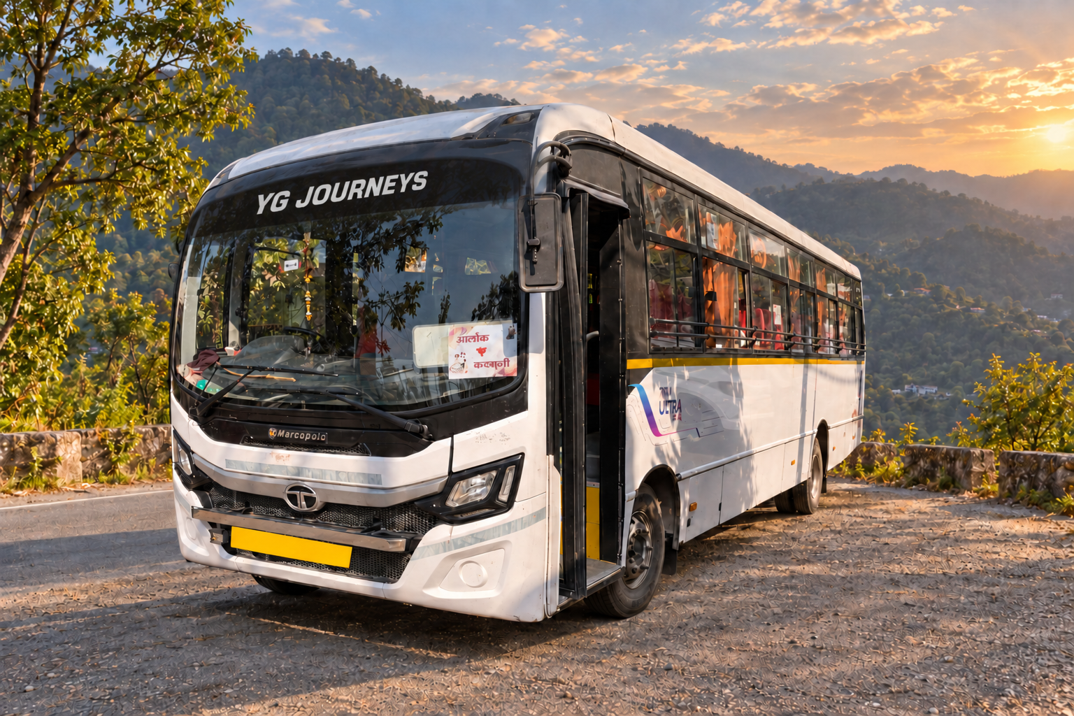 YG Journeys group travel bus on a scenic mountain road